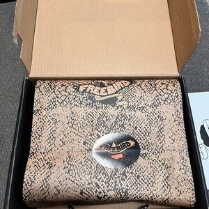 Open toe construction, this western inspired sandal